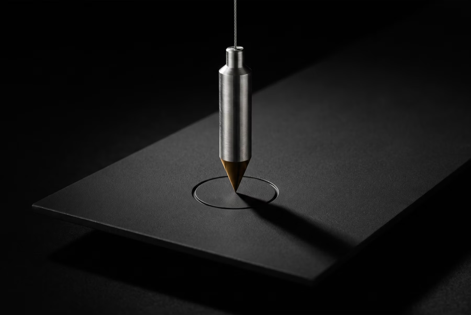 Precision instrument marking a target on a dark planning surface