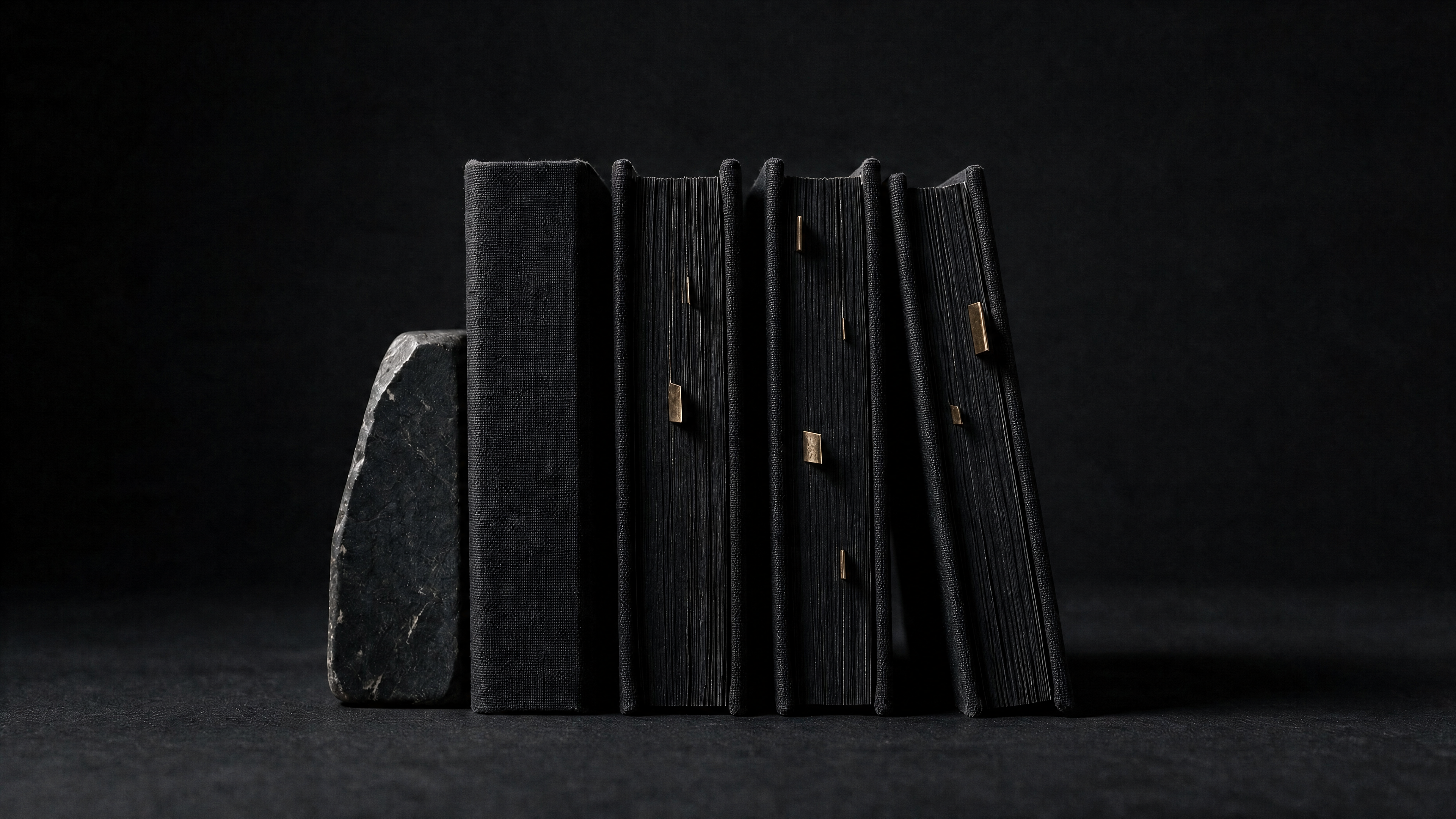 Black books with gold page markers representing an AI-ready publishing library